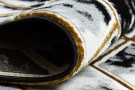 Kusový koberec Allure 1966 black/gold